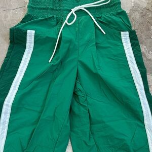 Green Athletic Shorts with White Stripes